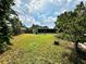 Large backyard with screened patio and plenty of green space at 6004 Hilltop E Ln, Lakeland, FL 33809