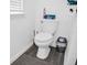 Bathroom with toilet and gray waste bin at 7474 Sw 78Th Ter, Ocala, FL 34481