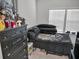 Bedroom with a dark dresser and a bed with pillows at 7474 Sw 78Th Ter, Ocala, FL 34481