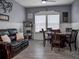 Common area with a leather couch and a round dining table at 7474 Sw 78Th Ter, Ocala, FL 34481
