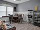 Game room features a popcorn machine, refrigerator, and seating area at 7474 Sw 78Th Ter, Ocala, FL 34481