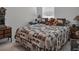 Guest bedroom with a bear-themed comforter and nightstands at 7474 Sw 78Th Ter, Ocala, FL 34481