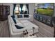 Living Room with large sectional sofa and a large TV at 7474 Sw 78Th Ter, Ocala, FL 34481