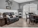 Common area with a leather couch and a round dining table at 7474 Sw 78Th Ter, Ocala, FL 34481