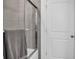 Bathroom with shower and white door at 7474 Sw 78Th Ter, Ocala, FL 34481