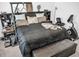 Main bedroom with king-size bed and exercise bike at 7474 Sw 78Th Ter, Ocala, FL 34481