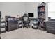 Home office with a corner desk, built-in shelving, and printer at 7474 Sw 78Th Ter, Ocala, FL 34481