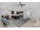 Open living room with kitchen island and hardwood floors at 1126 Whitewater Bay Dr, Groveland, FL 34736
