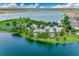 Community overview featuring a clubhouse, pool, and lake at 1126 Whitewater Bay Dr, Groveland, FL 34736