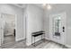 Modern entryway with gray tile floors, a console table, and half bath at 1126 Whitewater Bay Dr, Groveland, FL 34736