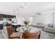 Kitchen dining area with glass table and modern pendants at 1126 Whitewater Bay Dr, Groveland, FL 34736