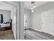Bright entryway with wood-look tile floor and view of bedroom at 1126 Whitewater Bay Dr, Groveland, FL 34736