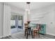 Bright dining area with glass table and access to backyard at 1126 Whitewater Bay Dr, Groveland, FL 34736