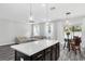 Modern kitchen with island and white countertops at 1126 Whitewater Bay Dr, Groveland, FL 34736