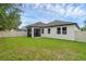 Spacious backyard with grassy lawn and privacy fence at 1126 Whitewater Bay Dr, Groveland, FL 34736