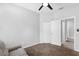 Bedroom with light walls, ceiling fan and couch at 1126 Whitewater Bay Dr, Groveland, FL 34736