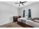 Spacious bedroom with wood dresser and ceiling fan at 1126 Whitewater Bay Dr, Groveland, FL 34736