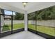 Relaxing screened porch overlooking backyard at 1126 Whitewater Bay Dr, Groveland, FL 34736