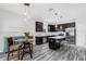 Modern kitchen with dark cabinets and island at 1126 Whitewater Bay Dr, Groveland, FL 34736