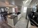 Modern kitchen with granite countertops and stainless steel appliances at 2729 N Poinciana Blvd # 117, Kissimmee, FL 34746