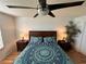 Bright bedroom with wood floors and a ceiling fan at 2729 N Poinciana Blvd # 117, Kissimmee, FL 34746