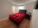Bedroom with a queen bed and nightstand at 2729 N Poinciana Blvd # 117, Kissimmee, FL 34746