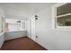 Relaxing screened porch with wood flooring and exterior access at 450 Avenue B Ne, Winter Haven, FL 33881