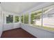 Bright screened porch with access to the backyard at 450 Avenue B Ne, Winter Haven, FL 33881