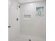 Stylish bathroom with white vanity and marble-look flooring at 450 Avenue B Ne, Winter Haven, FL 33881