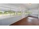 Bright front porch featuring a view of the street and surrounding neighborhood at 450 Avenue B Ne, Winter Haven, FL 33881