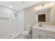 Modern bathroom with white subway tile and a large shower at 450 Avenue B Ne, Winter Haven, FL 33881