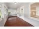 Inviting front porch with wood flooring and ample natural light at 450 Avenue B Ne, Winter Haven, FL 33881
