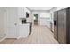 Updated kitchen boasting stainless steel appliances and light wood flooring at 450 Avenue B Ne, Winter Haven, FL 33881