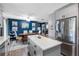 Modern kitchen with gray cabinets, a large island, and stainless steel appliances at 4314 Ridge Rd, Lakeland, FL 33811