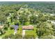 Aerial view of a house and surrounding neighborhood, showing lush green landscape and neighborhood homes at 4314 Ridge Rd, Lakeland, FL 33811