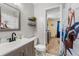 Clean bathroom with single sink vanity, toilet and shower/tub combo at 4314 Ridge Rd, Lakeland, FL 33811