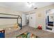 bedroom with a house-shaped bed, view of kitchen at 4314 Ridge Rd, Lakeland, FL 33811