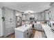 Updated kitchen boasts gray cabinets, a large island, and stainless steel appliances at 4314 Ridge Rd, Lakeland, FL 33811