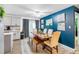 Bright kitchen features an island, stainless steel appliances, and white shaker cabinets at 4314 Ridge Rd, Lakeland, FL 33811