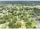 Aerial view of residential neighborhood with houses surrounded by trees and green spaces at 4314 Ridge Rd, Lakeland, FL 33811