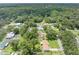 Aerial view of residential neighborhood with mature trees and houses, offering a peaceful suburban setting at 4314 Ridge Rd, Lakeland, FL 33811