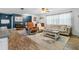 Spacious living room with hardwood floors, comfortable seating, and a ceiling fan at 4314 Ridge Rd, Lakeland, FL 33811