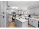 Modern kitchen with gray cabinets, quartz countertops, and stainless steel appliances at 4314 Ridge Rd, Lakeland, FL 33811