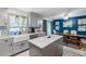Open kitchen with gray cabinets, white quartz countertops, and stainless steel appliances at 4314 Ridge Rd, Lakeland, FL 33811