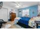 Bedroom with a dresser and a bed with blue bedding at 4314 Ridge Rd, Lakeland, FL 33811