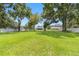 Large backyard with playset and mature trees at 4314 Ridge Rd, Lakeland, FL 33811