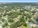 Aerial view of a neighborhood, showing numerous houses, lush green trees and a quiet suburban atmosphere at 4314 Ridge Rd, Lakeland, FL 33811