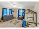 bedroom with a house-shaped bed, dresser, and playful rug at 4314 Ridge Rd, Lakeland, FL 33811