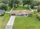 Aerial view of a house with a large front yard and driveway at 4314 Ridge Rd, Lakeland, FL 33811