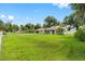 Ranch style home with a spacious lawn and mature trees at 4314 Ridge Rd, Lakeland, FL 33811
